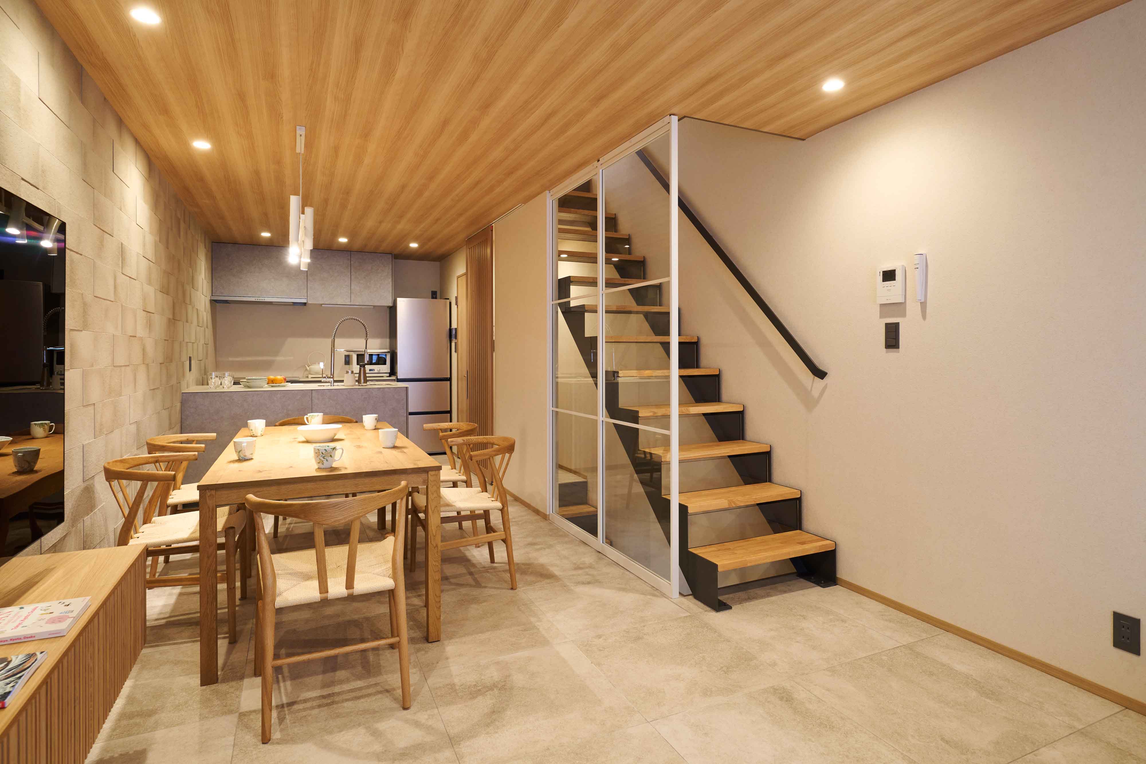 Dining area with a wooden table and staircase