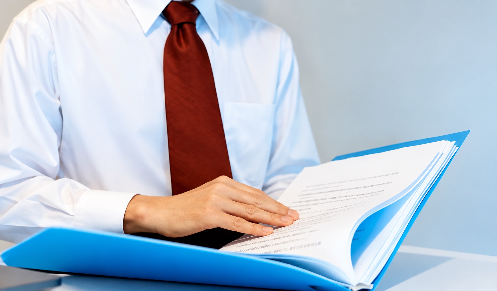 Businessperson reading a document at a desk